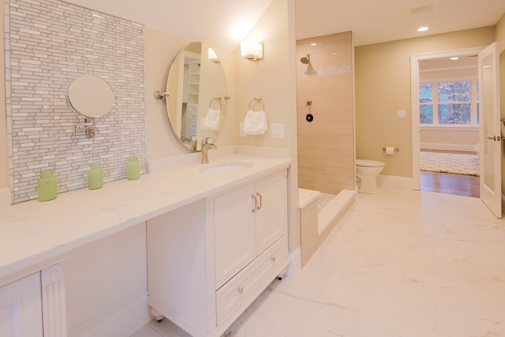 9 Holton Road Lexington, MA 02421 - Photo 12 of 27 a spacious bathroom with a sink a mirror and a shower