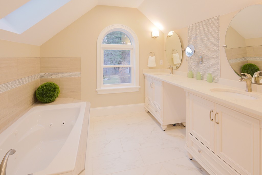 9 Holton Road Lexington, MA 02421 - Photo 13 of 27 a bathroom with a sink mirror and vanity