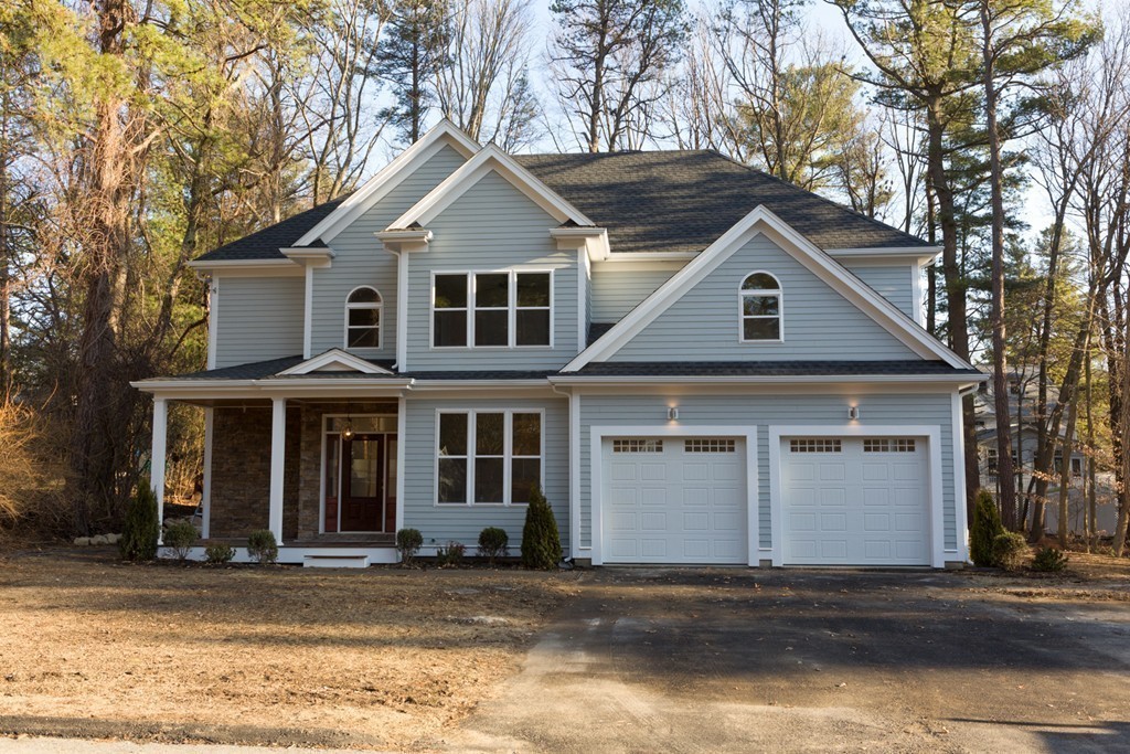 9 Holton Road Lexington, MA 02421 - Photo 27 of 27 a front view of a house with a yard