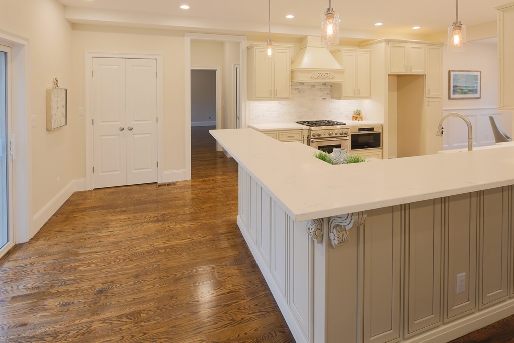 9 Holton Road Lexington, MA 02421 - Photo 3 of 27 a kitchen with kitchen island a counter top space a sink and appliances