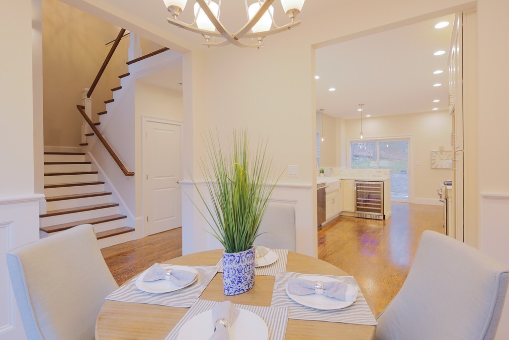 9 Holton Road Lexington, MA 02421 - Photo 6 of 27 a dining room with furniture and a potted plant