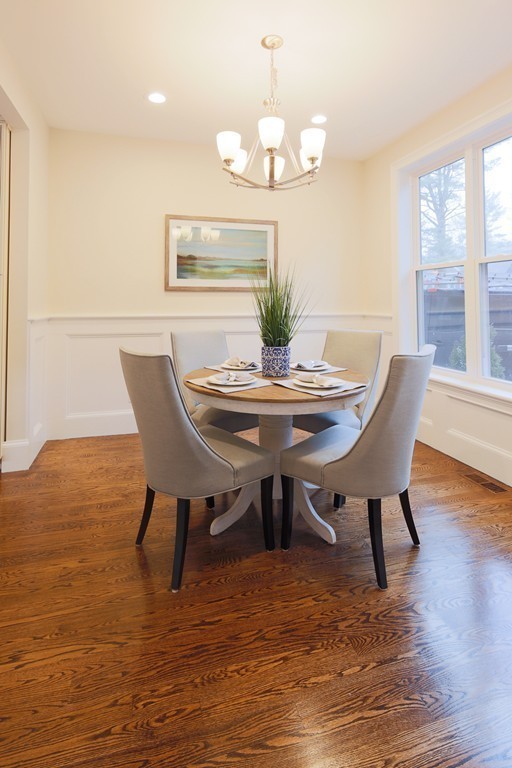9 Holton Road Lexington, MA 02421 - Photo 7 of 27 a view of a dining room with furniture wooden floor and chandelier