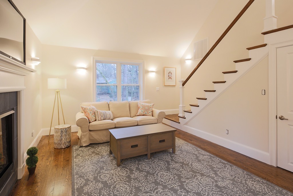 9 Holton Road Lexington, MA 02421 - Photo 8 of 27 a living room with furniture and a painting on the wall