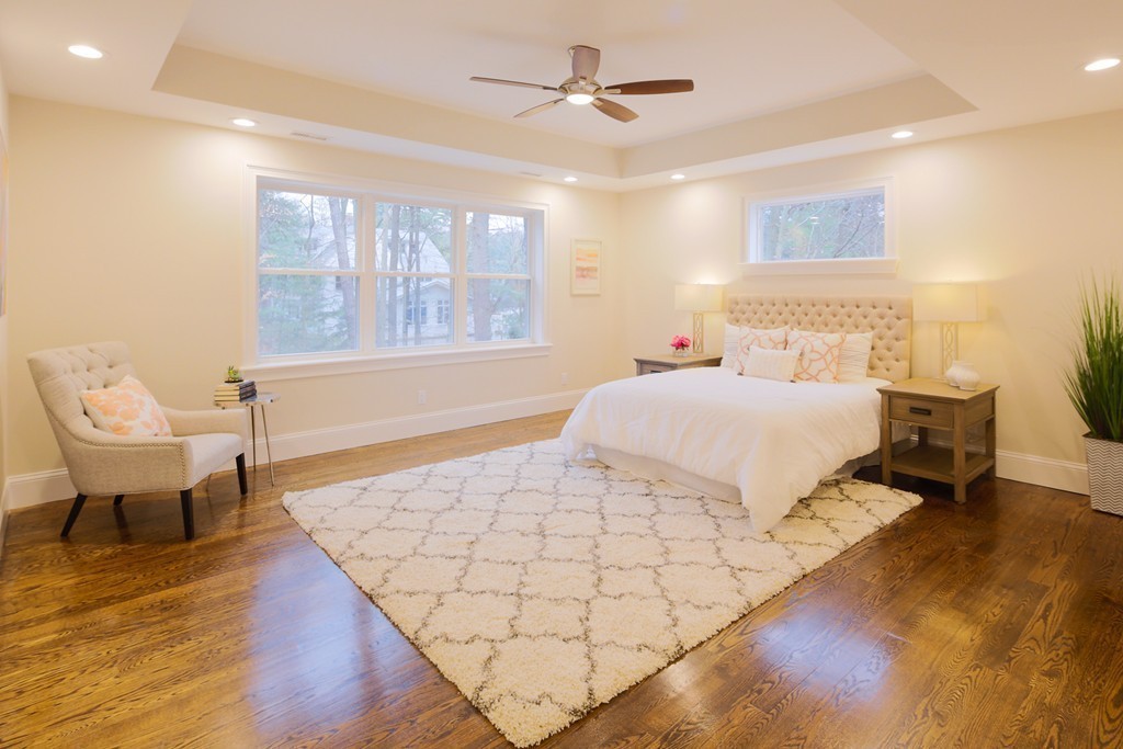 9 Holton Road Lexington, MA 02421 - Photo 10 of 27 a bedroom with a bed and a chair