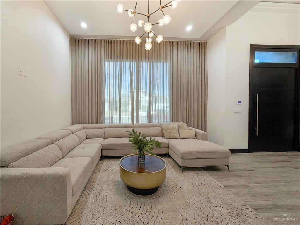 2202 Mirabelle Street Mission, TX 78572 - Photo 3 of 18 a living room with furniture and a chandelier