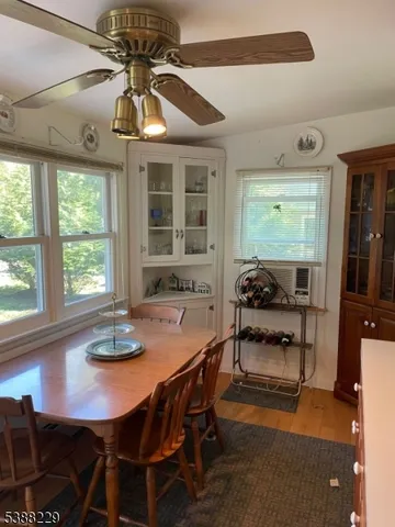 a dining room with furniture and window