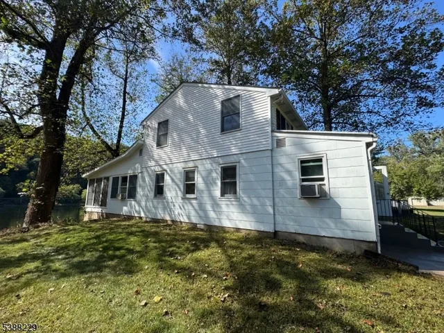 a view of house with yard