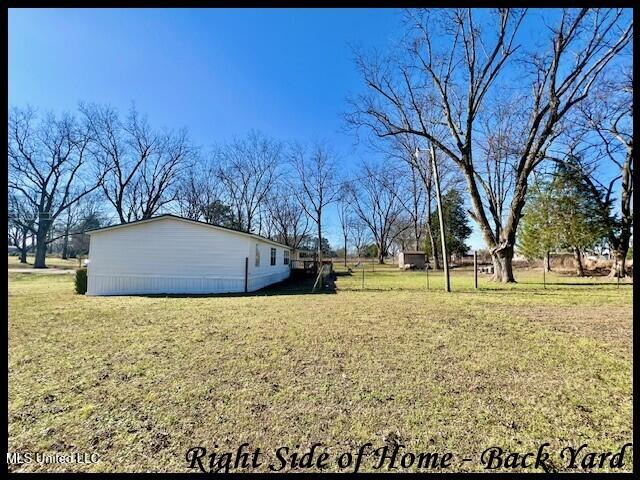 5089 Sees Chapel Road Crenshaw, MS 38621 - Photo 48 of 59 5089 SEES CHAPEL - RIGHT SIDE OF HOME -