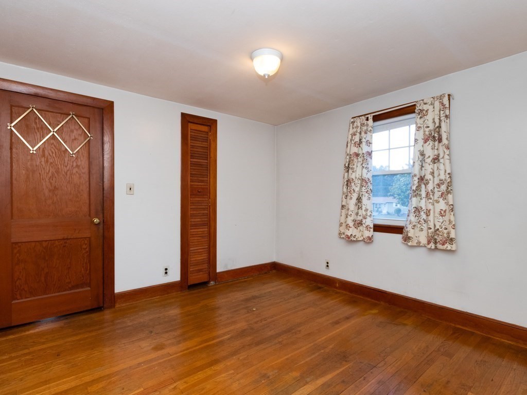 64 Judith Road Weymouth, MA 02191 - Photo 18 of 27 wooden floor in an empty room with a window