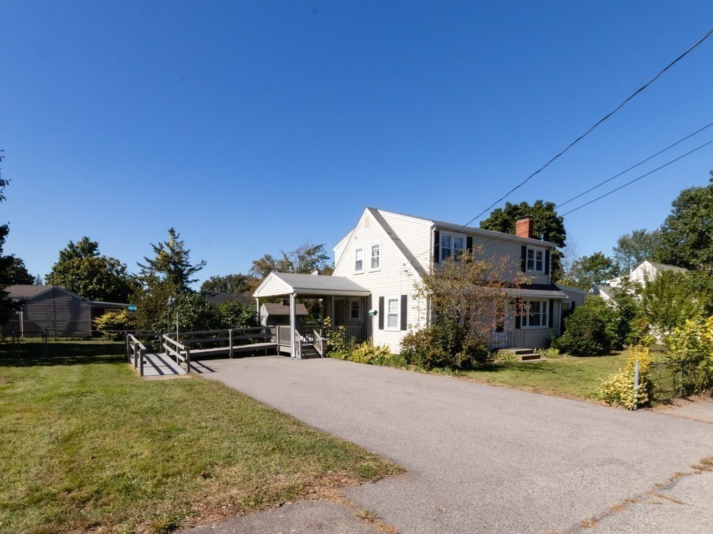 64 Judith Road Weymouth, MA 02191 - Photo 4 of 27 a front view of a house with a garden