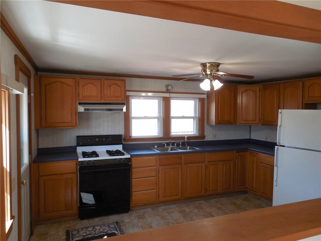 965 Watson Pond Road Rome, ME 04963 - Photo 8 of 29 This kitchen offers lots of cabinets...