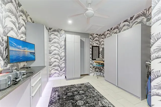 an aerial view of a house with a garden and lake view