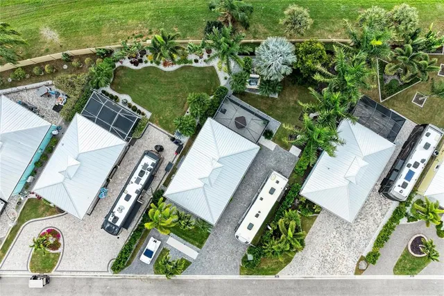 an aerial view of a house with a yard