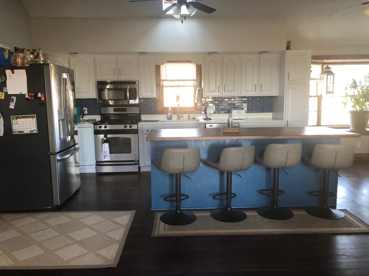 791 North 36th Road Utica, IL 61373 - Photo 7 of 24 a kitchen with stainless steel appliances a dining table chairs refrigerator and sink