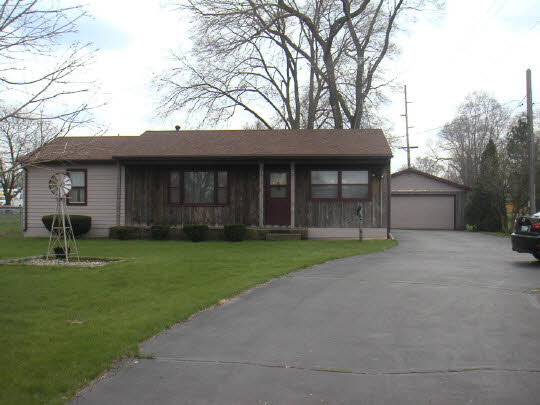 5502 State Line Road South Beloit, IL 61080 - Photo 1 of 3 a view of a house with backyard and a tree