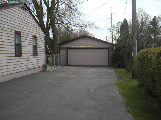 5502 State Line Road South Beloit, IL 61080 - Photo 2 of 3 a view of garage and yard