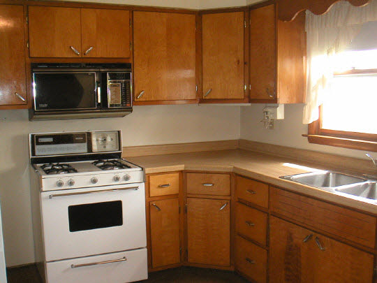 5502 State Line Road South Beloit, IL 61080 - Photo 3 of 3 a kitchen with a stove microwave and sink