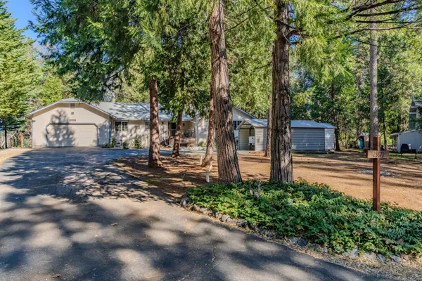 a view of a house with a small yard