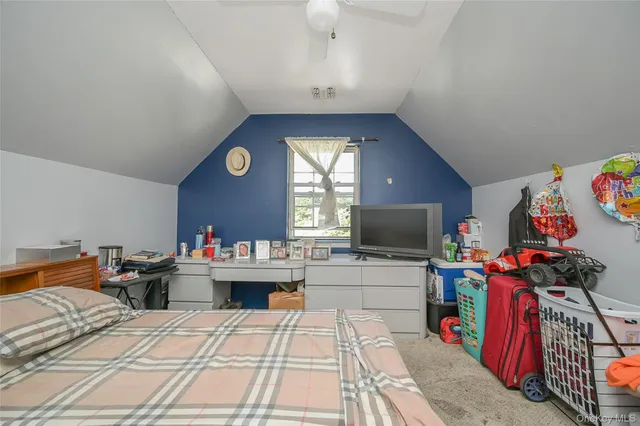 a living room with lots of furniture and a flat screen tv