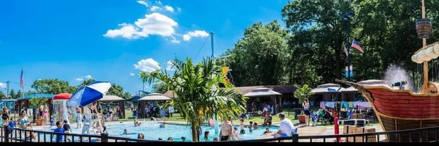 a view of a patio with table and chairs potted plants