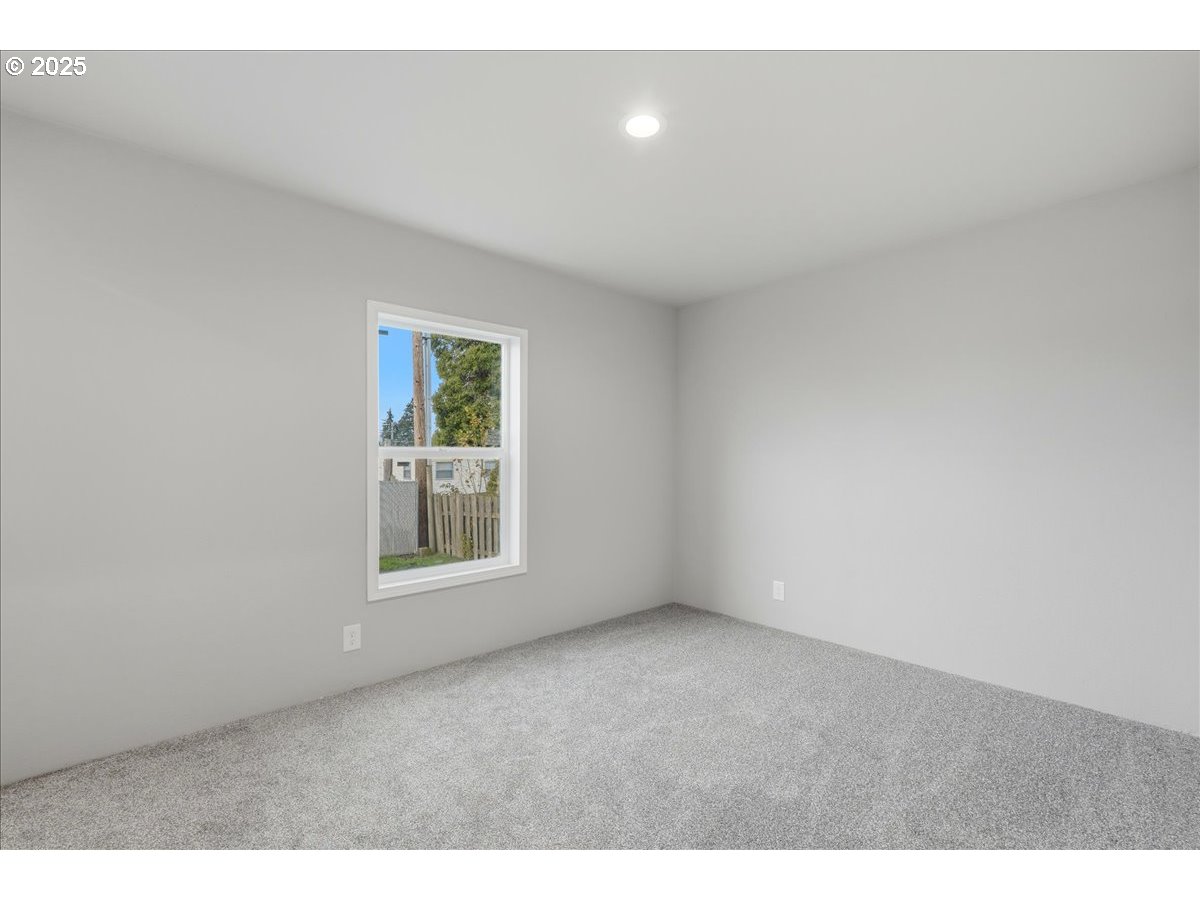 20815 Walnut Street Northeast Aurora, OR 97002 - Photo 17 of 32 a view of an empty room with a window