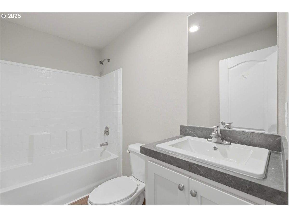 20815 Walnut Street Northeast Aurora, OR 97002 - Photo 24 of 32 a bathroom with a sink a toilet and shower