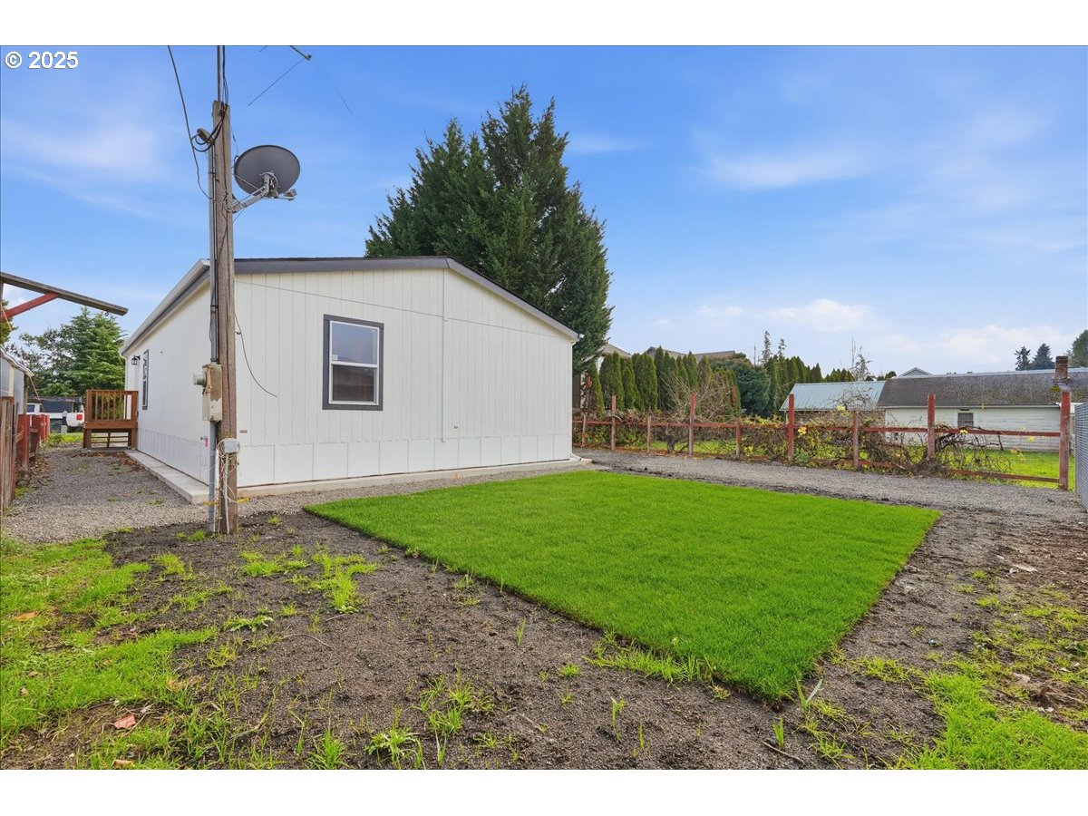 20815 Walnut Street Northeast Aurora, OR 97002 - Photo 30 of 32 a view of a backyard with large trees