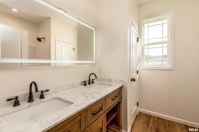 a bathroom with a sink and a mirror
