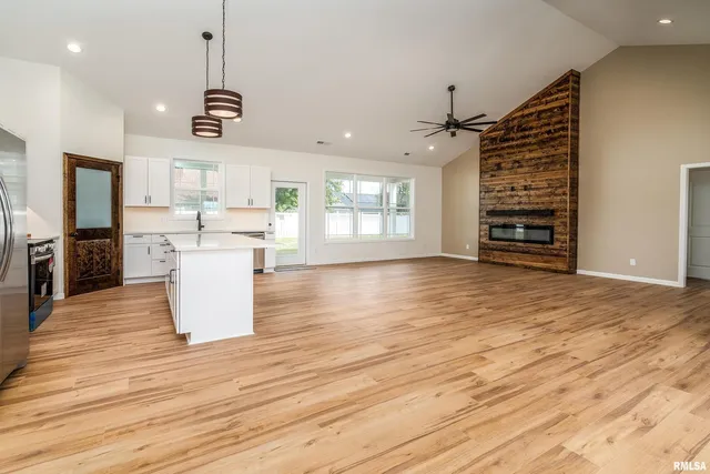 a view of a kitchen with microwave and cabinets
