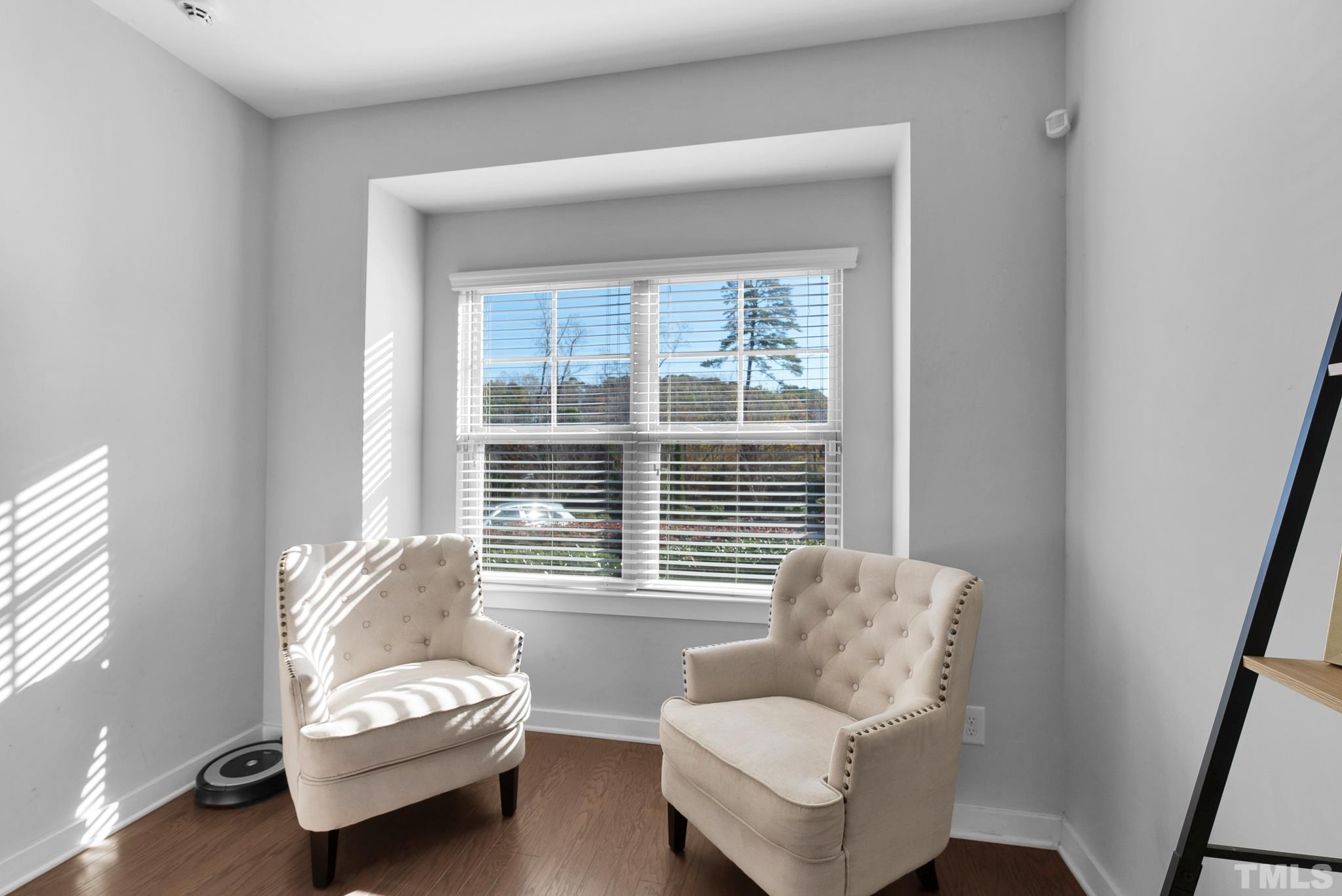 7810 Allscott Way Raleigh, NC 27612 - Photo 11 of 29 a living room with furniture and a window
