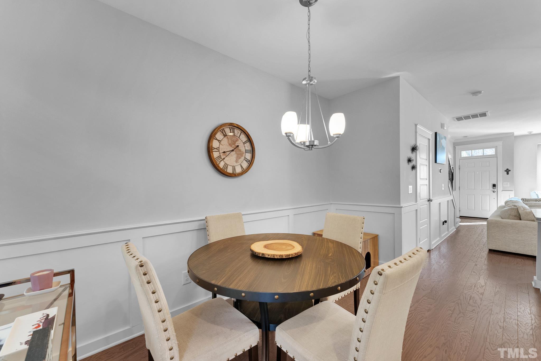 7810 Allscott Way Raleigh, NC 27612 - Photo 18 of 29 a view of a dining room with furniture and wooden floor