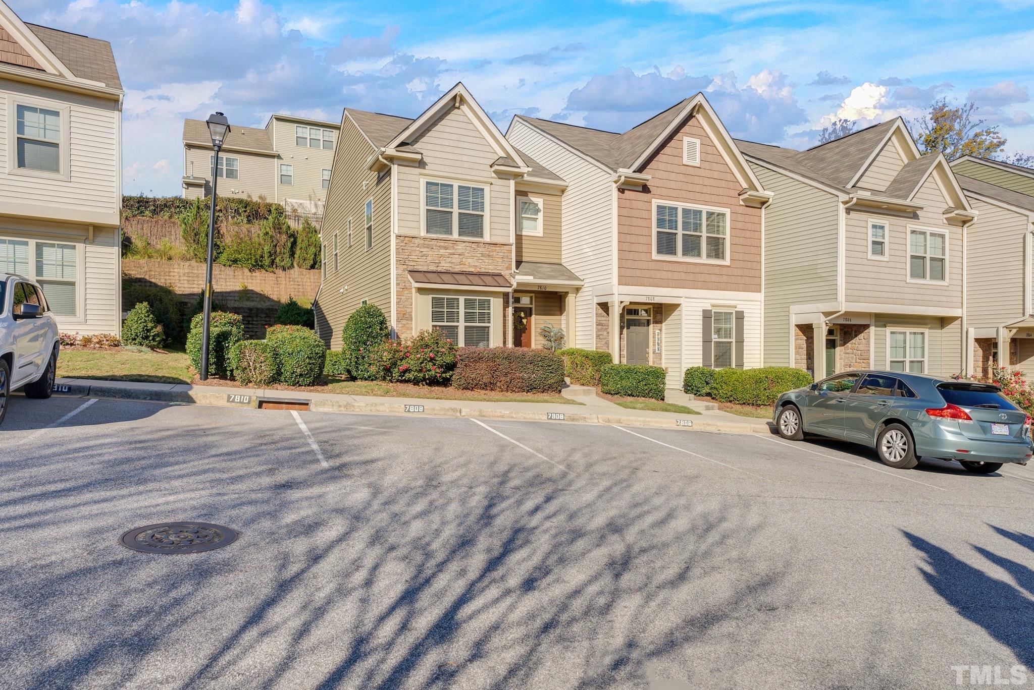 7810 Allscott Way Raleigh, NC 27612 - Photo 2 of 29 a car parked in front of a white house