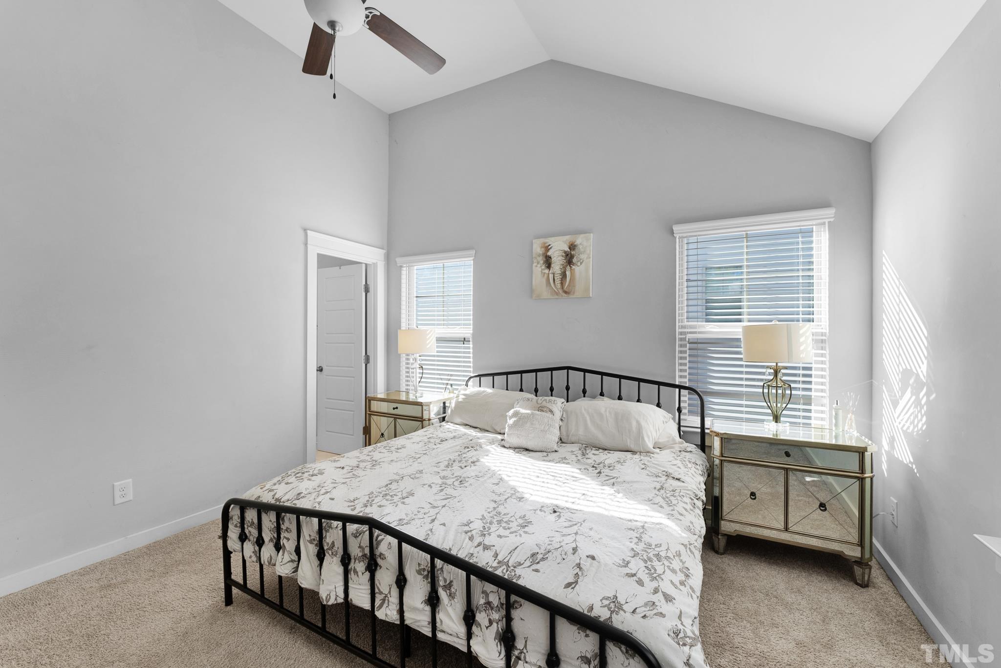 7810 Allscott Way Raleigh, NC 27612 - Photo 24 of 29 a bedroom with a bed and a window
