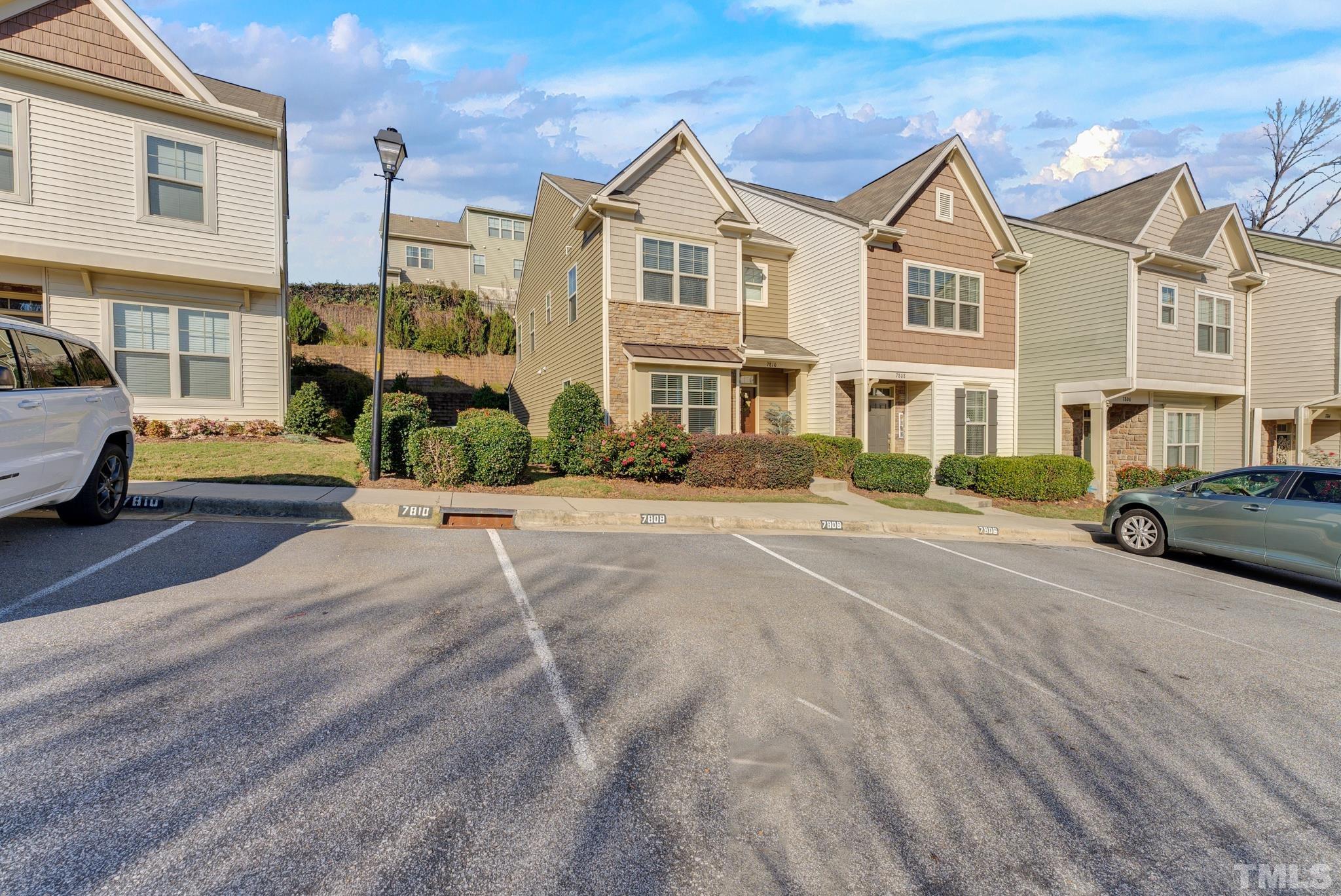7810 Allscott Way Raleigh, NC 27612 - Photo 4 of 29 a view of multiple houses with a street