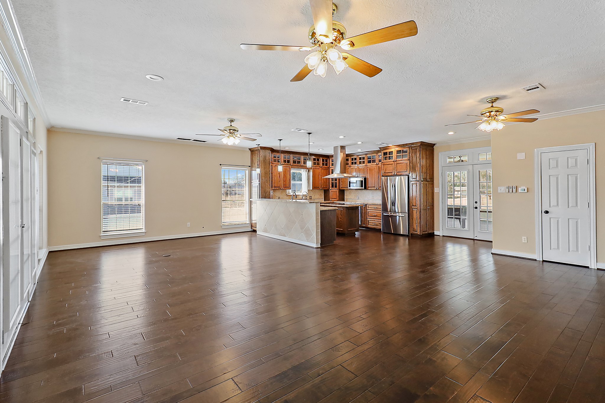 1306 Spring Branch Drive Baytown, TX 77523 - Photo 30 of 38 a view of an empty room with a window and wooden floor