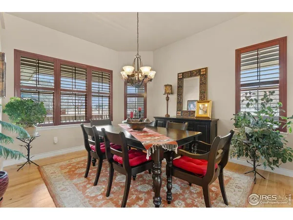 a kitchen with stainless steel appliances kitchen island granite countertop a stove a sink a refrigerator and a microwave