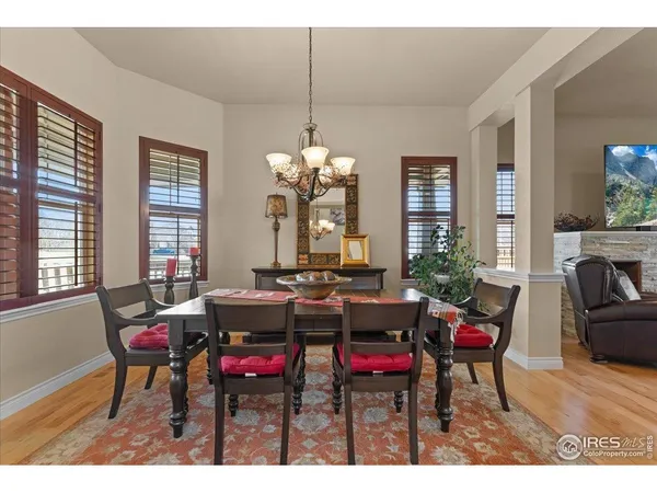 a view of a dining room with furniture and window