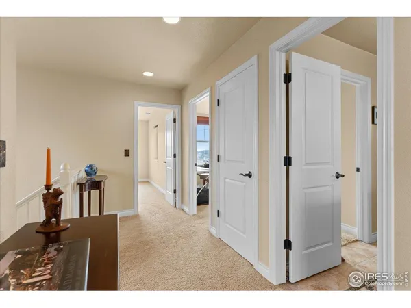 a bathroom with a granite countertop sink a large mirror and a shower