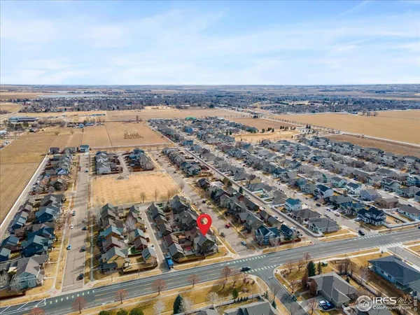 a view of a lake with table and chairs