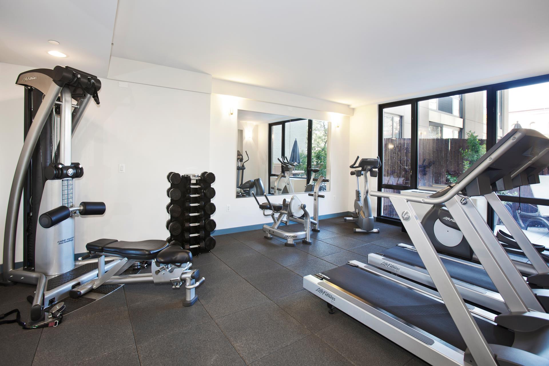 1595 Lexington Avenue, Unit 8C Manhattan, NY 10029 - Photo 6 of 10 a view of a room with gym equipment