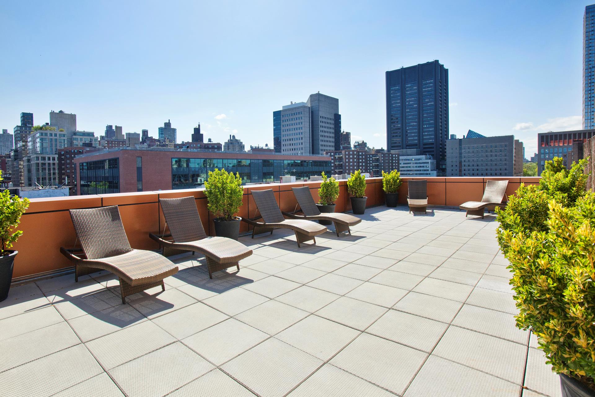 1595 Lexington Avenue, Unit 8C Manhattan, NY 10029 - Photo 7 of 10 a view of a terrace with chairs