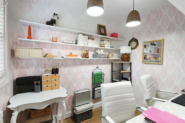 a living room with furniture and a chair