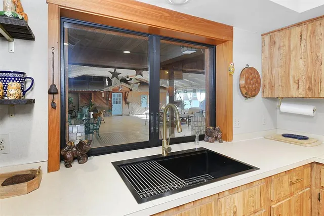 a kitchen with a sink and a refrigerator