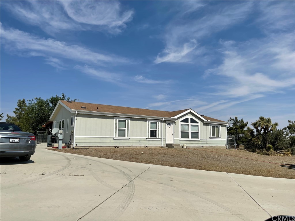a view of house with yard
