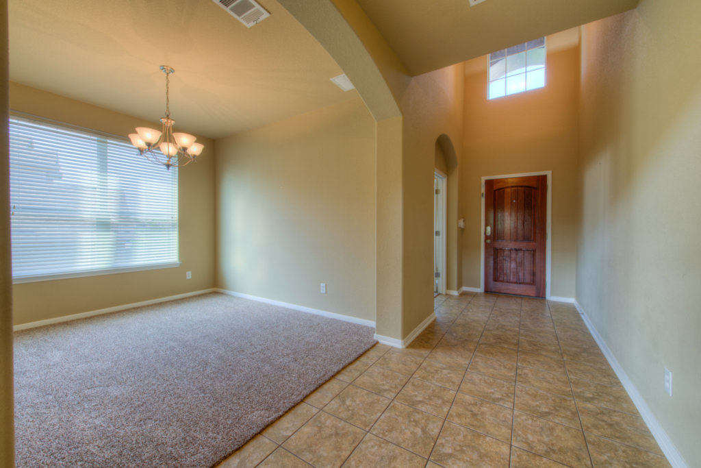 403 Limestone Trail Austin, TX 78737 - Photo 6 of 18 Enter into a welcoming foyer with soaring ceilings, leading to a generously proportioned room with ample natural light.