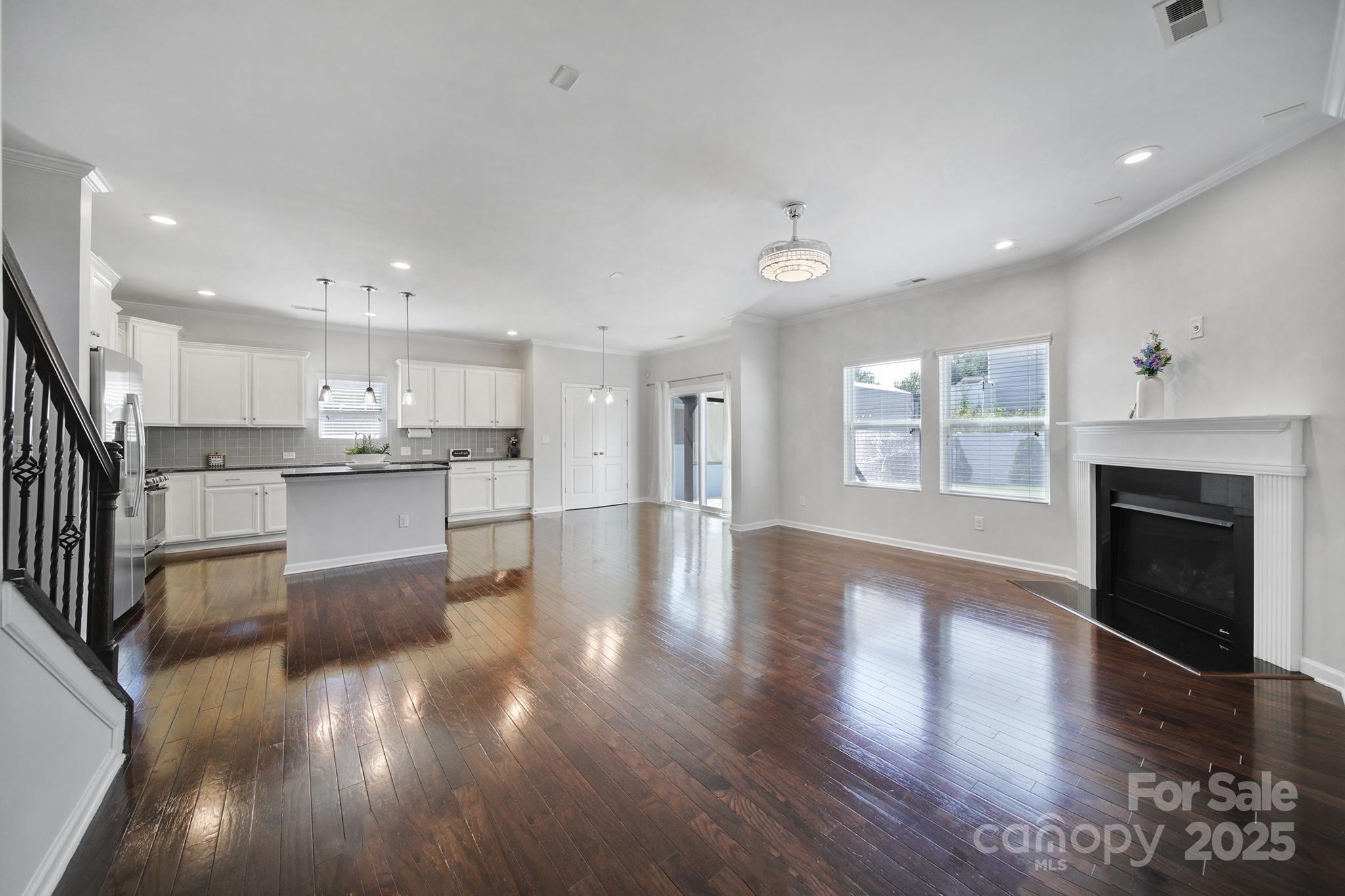 1541 Spring Blossom Trail Fort Mill, SC 29708 - Photo 13 of 43 a view of kitchen with cabinets and wooden floor
