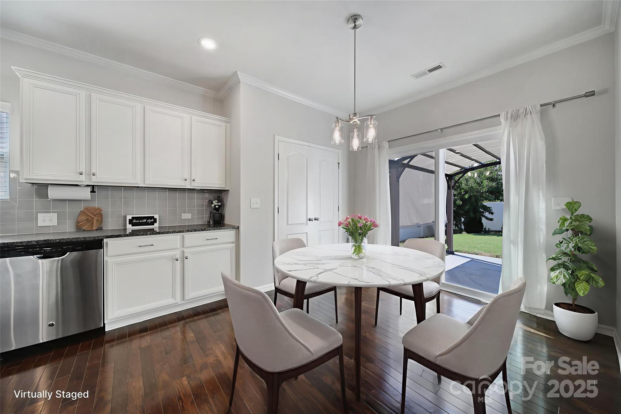 1541 Spring Blossom Trail Fort Mill, SC 29708 - Photo 15 of 43 a view of a dining room with furniture window and wooden floor