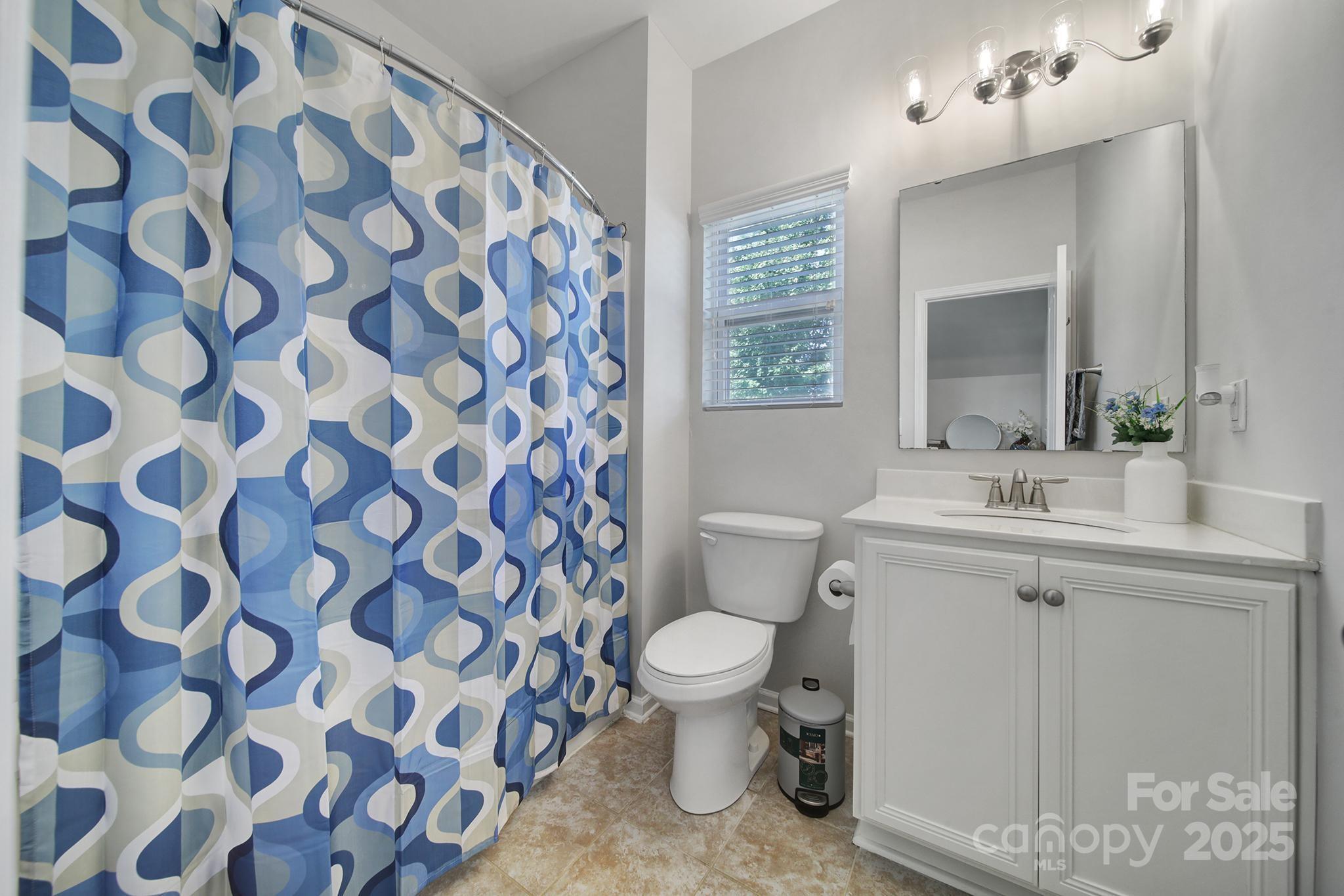 1541 Spring Blossom Trail Fort Mill, SC 29708 - Photo 19 of 43 a bathroom with a sink toilet and shower