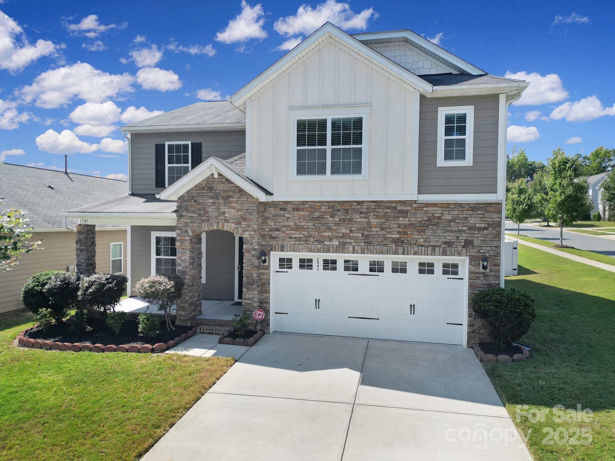 1541 Spring Blossom Trail Fort Mill, SC 29708 - Photo 3 of 43 a front view of house with yard and green space