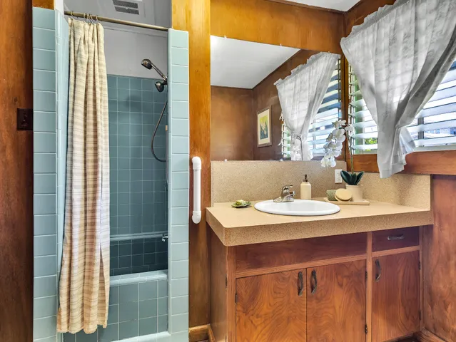 a view of a bathroom with a sink and mirror
